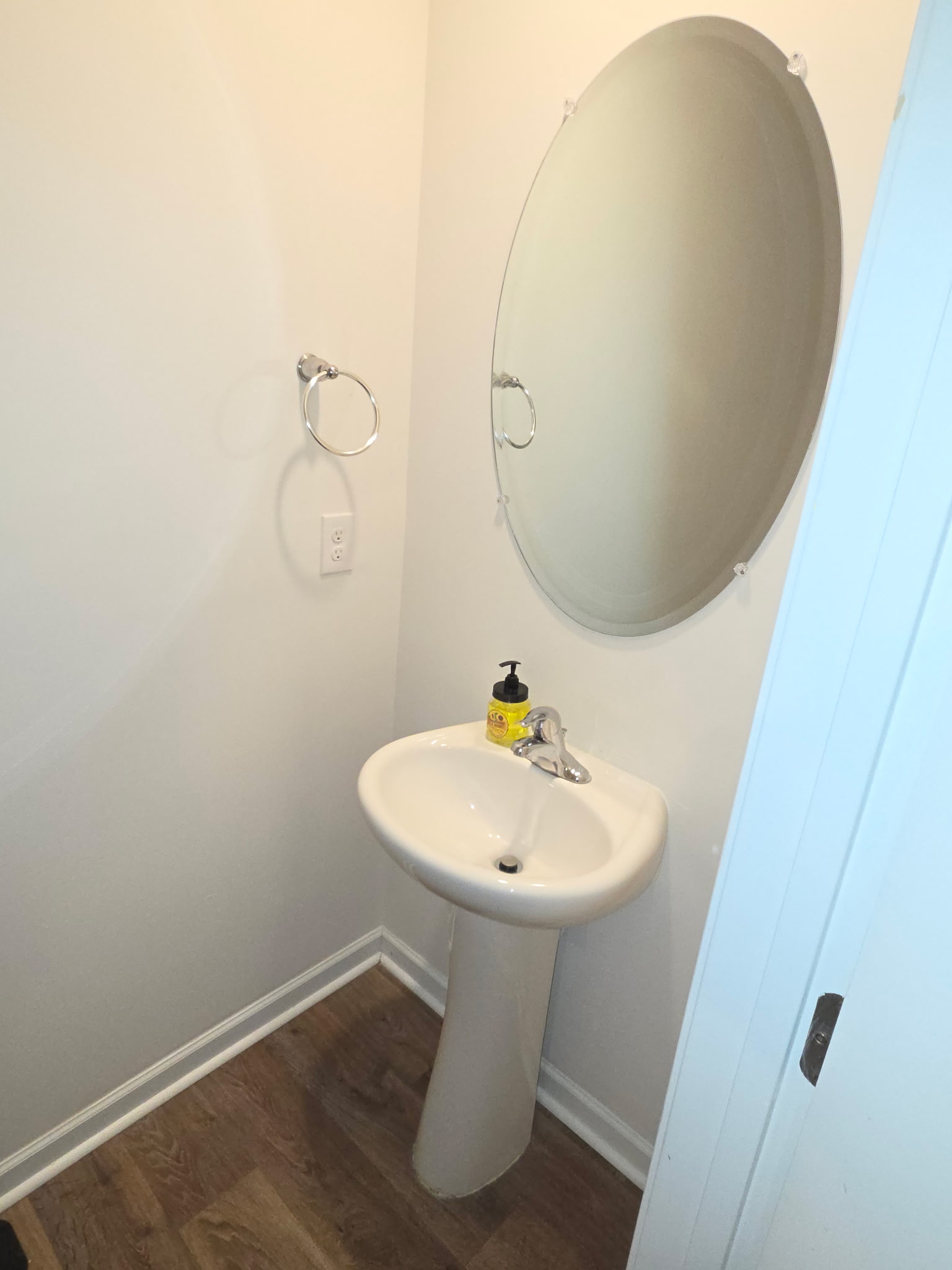 Half bathroom with sink and mirror