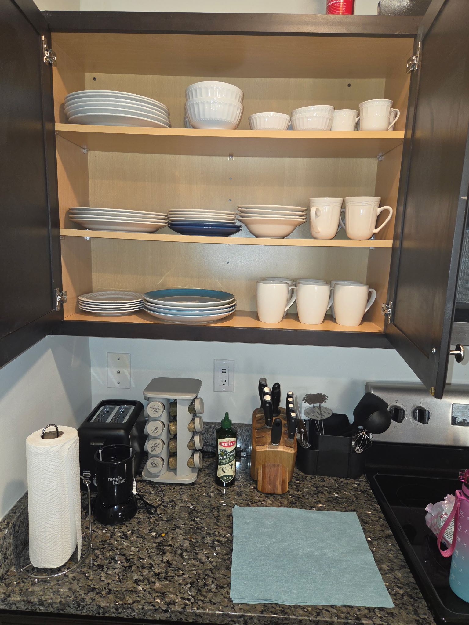 Open kitchen shelves with dishes and cookware