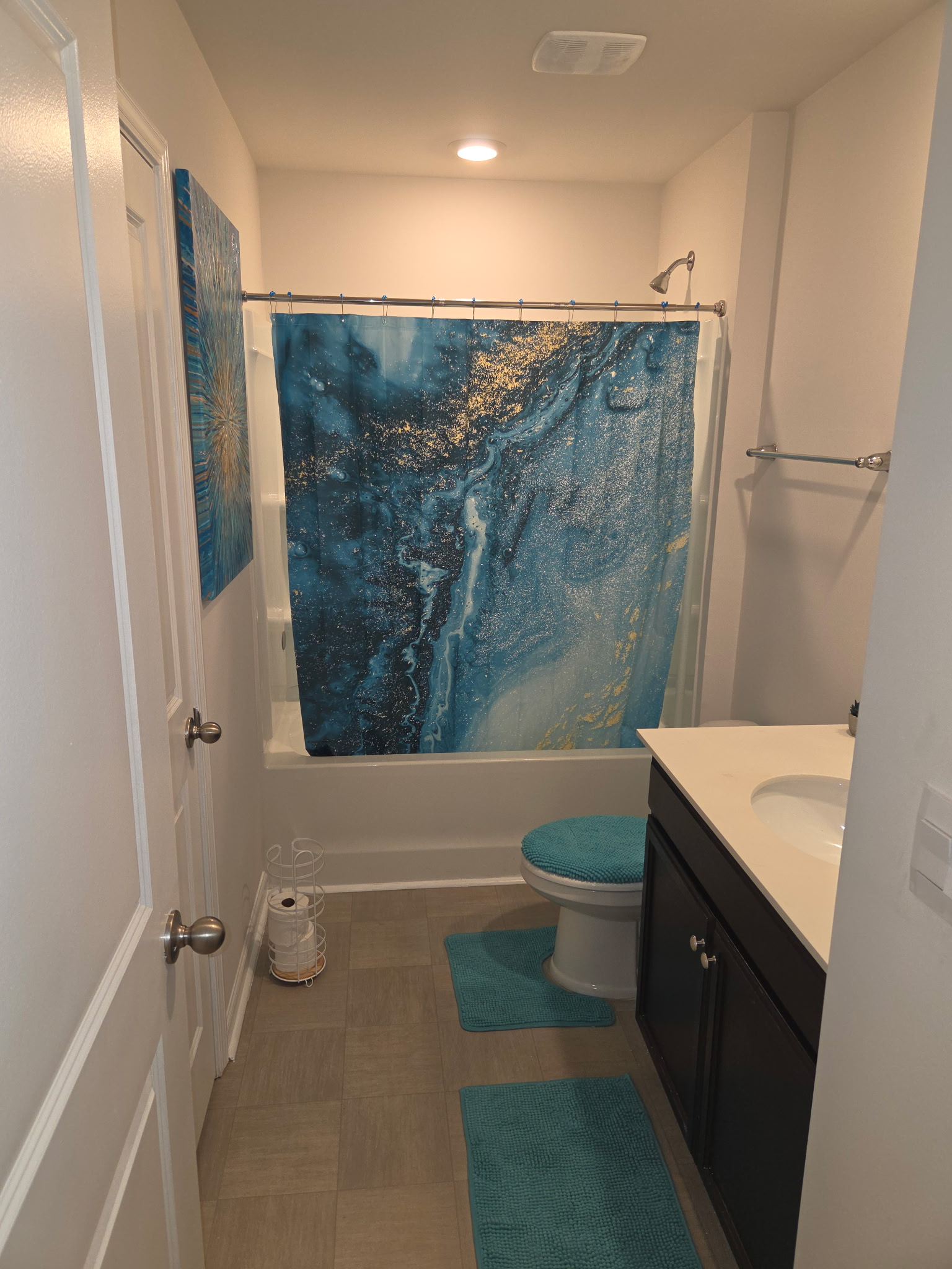Full bathroom with shower and vanity