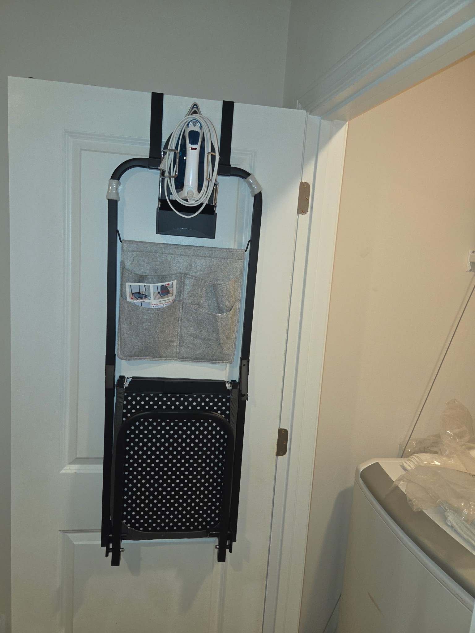 Laundry area with stacked washer and dryer