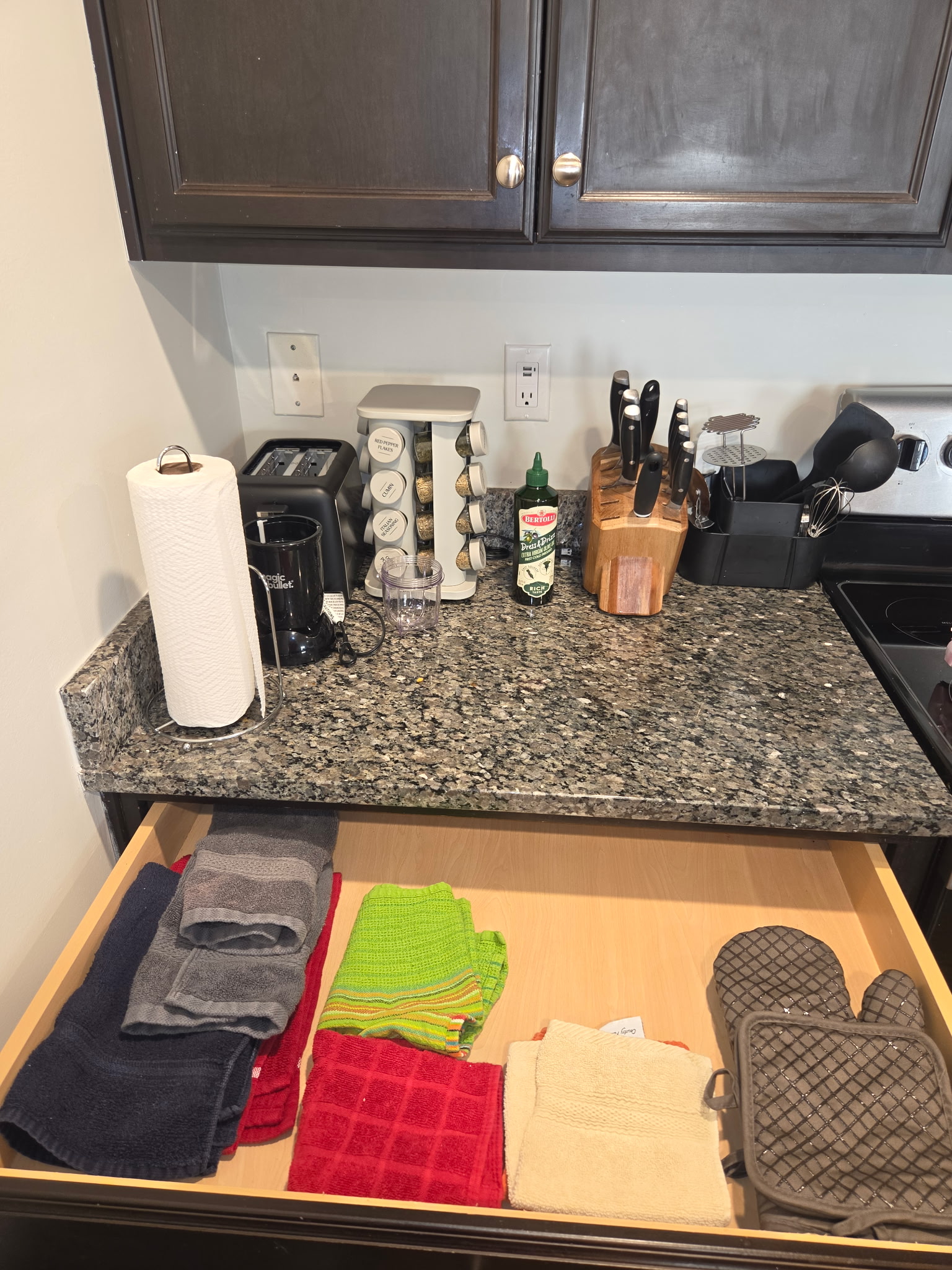 Kitchen counter and stocked drawers